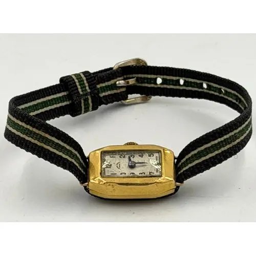 An 18ct gold Metro watch on fabric strap, approximate watch ...