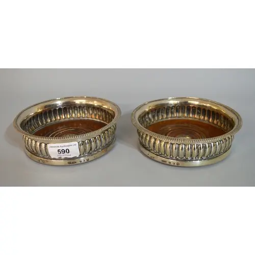 Pair of George III silver coasters, the gadroon rims above t...