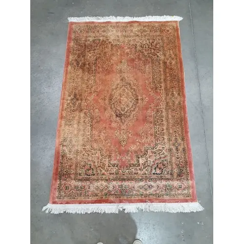 A Persian style Rug on beige and red ground with floral bord...