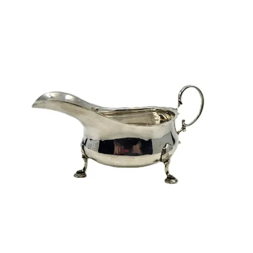 A MID-20TH-CENTURY SILVER (.925) MAPPIN & WEBB HELMET SHAPED...