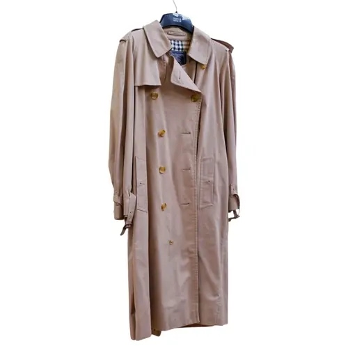 A Burberry beige trench coat, no size given, pit to pit appr...