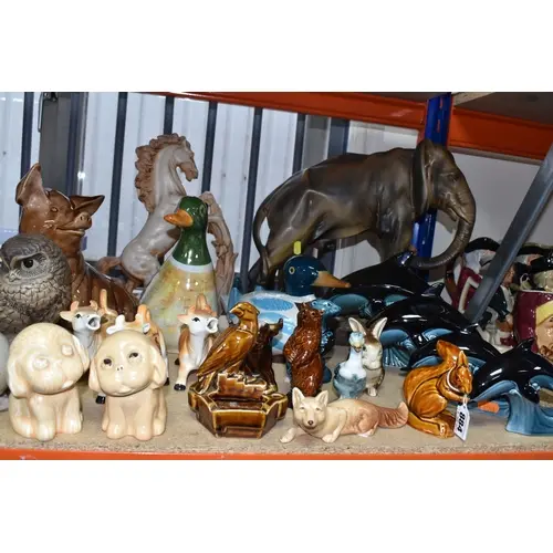 A GROUP OF ANIMAL THEMED SCULPTURES, comprising a large elep...