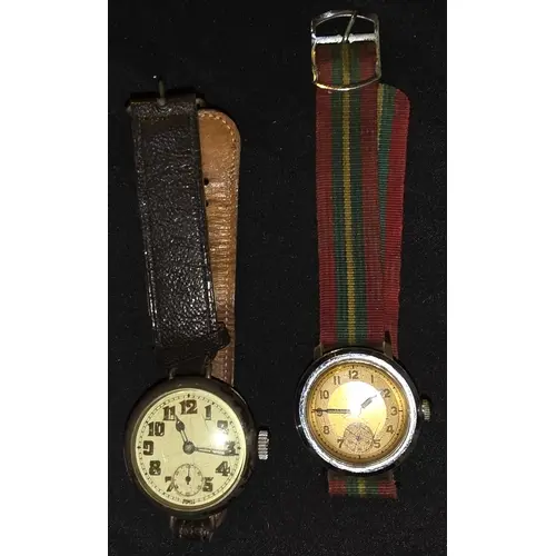 A WW1 officers trench style watch silver cased and a mid cen...