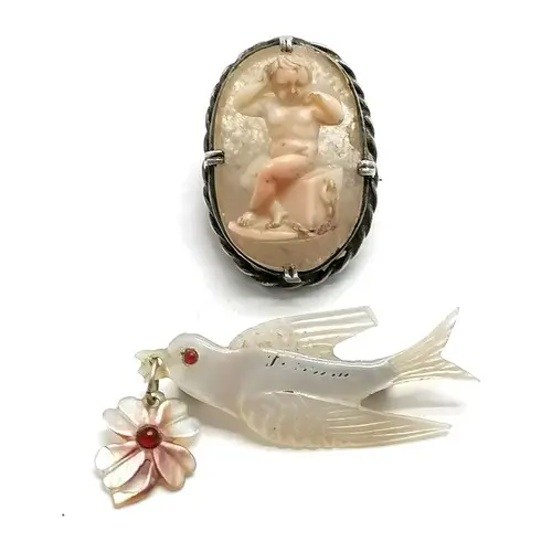 Antique hand carved coral cameo of a seated cupid chained to...