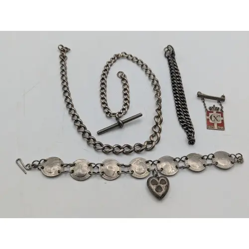 A group of silver and white metal items to include a silver ...