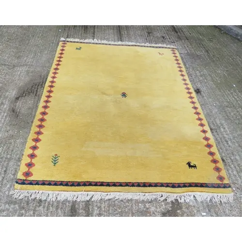 Yellow Tribal Rug with tassel ends, motifs of goat, person e...