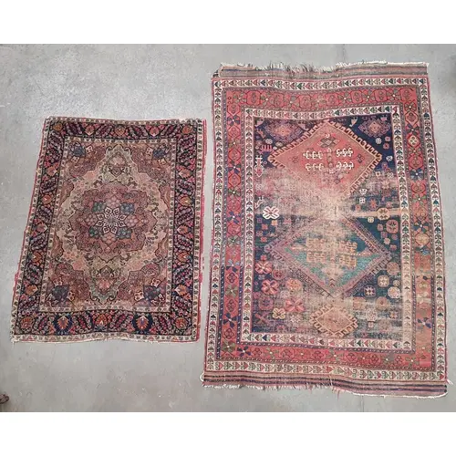 A Persian style Rug on beige ground with floral borders with...