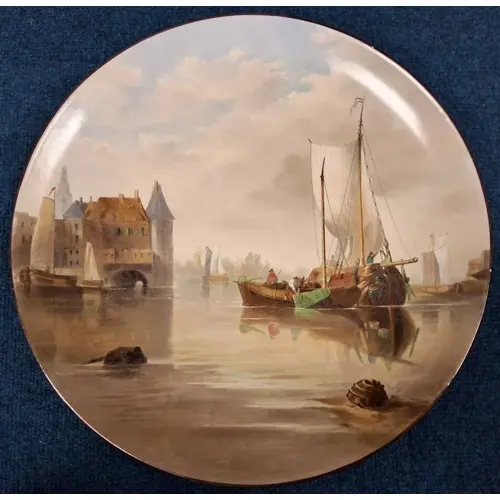 A MINTON CHARGER, painted with a scene of boats, titled 'Alk...