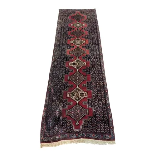 A 20th century Persian Hamadan carpet floor runner rug. The ...