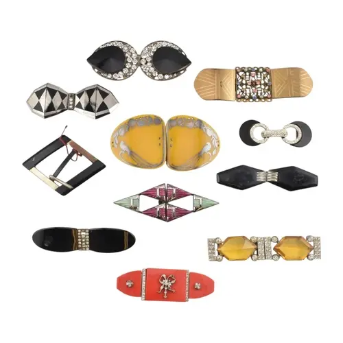 Art Deco enamel and rhinestone paste belt buckles. Eleven be...