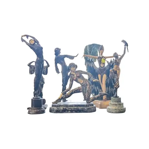 A collection of 20th century bronzed resin Art Deco style da...