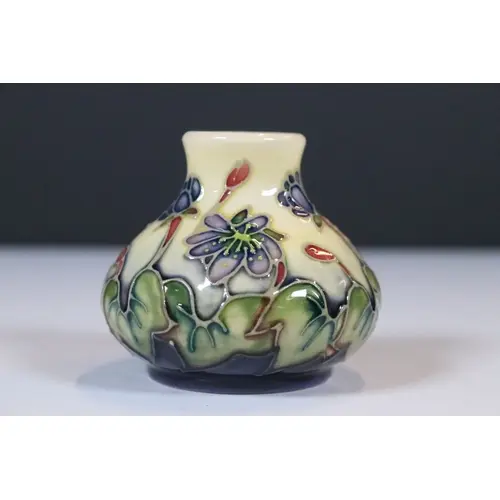 Moorcroft pottery 'Hepatica' pattern bud vase, designed by E...