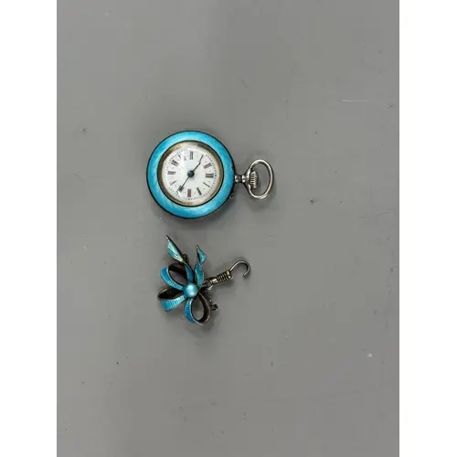 Watches: a ladies pin set silver and pale blue guilloche ena...