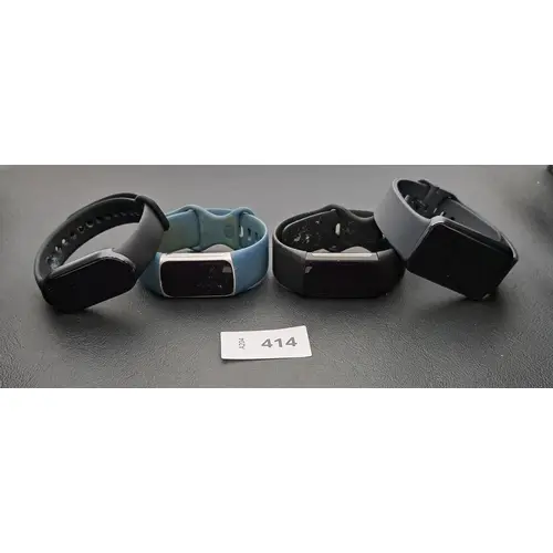 FOUR FITNESS TRACKERS comprising a Fitbit Inspire 5, a Fitbi...