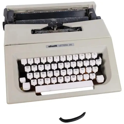 An Olivetti Lettera 25 portable typewriter, with wooden carr...