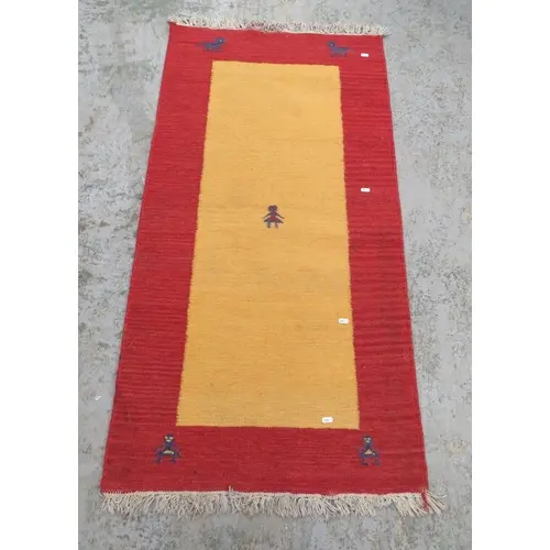 Tribal Rug, deep red ground, tribal style figures to border ...