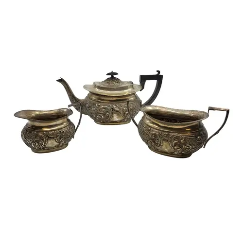 AN ANTIQUE THREE PIECE EDWARDIAN STERLING SILVER (.925) EMBO...