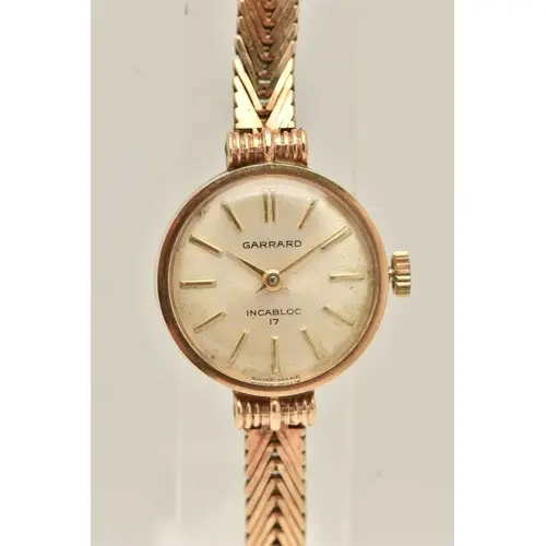 A LADIES BOXED 9CT GOLD 'GARRARD' WRISTWATCH, manual wind, r...