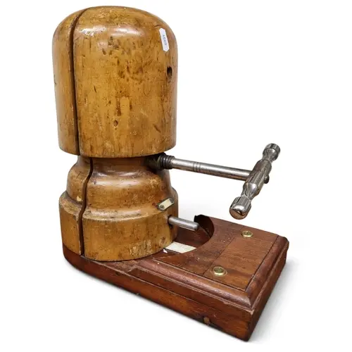 A late 19th Century Milliners hat Stretcher with sizing gaug...