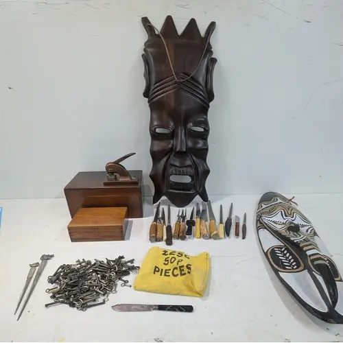 A mixed lot to include a large carded African tribal mask, a...