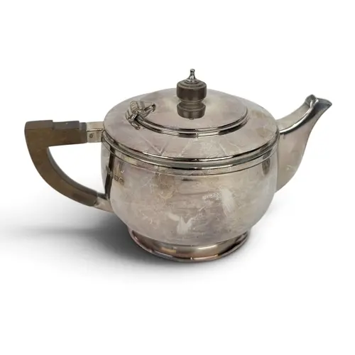 AN ART DECO CIRCULAR SILVER TEAPOT, DEAKIN & FRANCIS, BI...