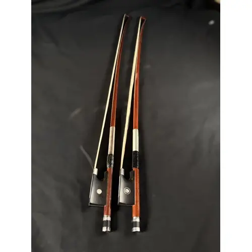 Two 20th century finely made silver mounted violin bows with...