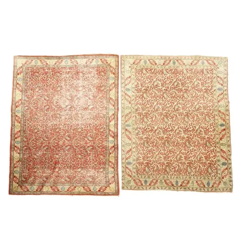 A near pair of red ground Qum carpets, early 20th century, t...