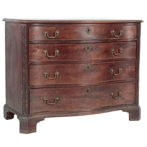 A George III mahogany serpentine chest of drawers, with moul...