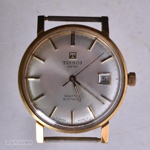 A TISSOT WATCH. Running. 3.5 cm wide.