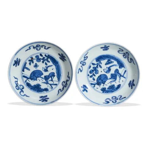 AN UNUSUAL PAIR OF BLUE AND WHITE SAUCER DISHES MING DYNASTY...