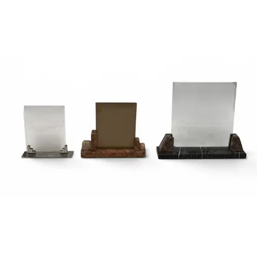 TWO ART DECO MARBLE PHOTOGRAPH FRAMES The largest 32cm wide ...