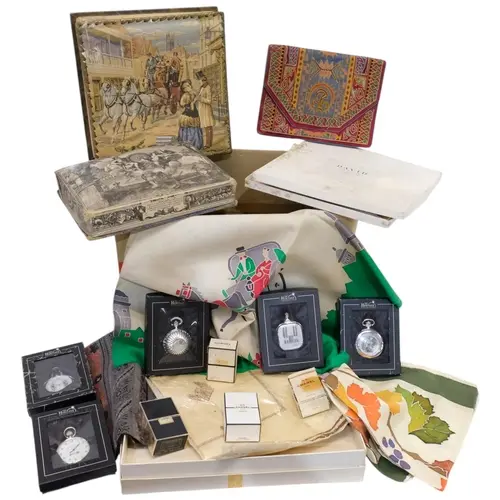 Boxed Chanel bottles, pocket watches, scarves, etc