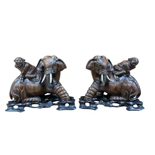 A pair of early 20th-century Chinese carved hardwood figures...
