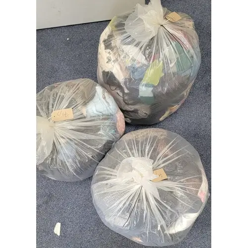 THREE BAGS OF HATS, SCARVES AND GLOVES including Barbour, Pu...