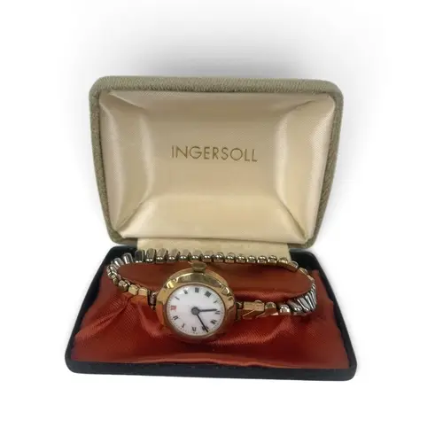 A 9CT GOLD WATCH WITH PLATED FLEXI STRAP