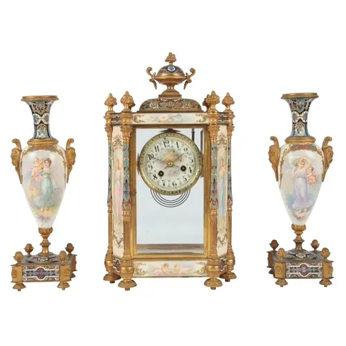 A French gilt brass and Champlevé enamel four glass mantel c...