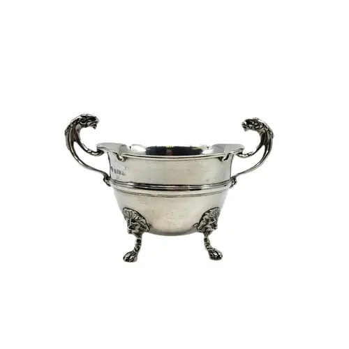 AN ANTIQUE GEORGE V STERLING SILVER TWIN HANDLED SUGAR BOWL,...