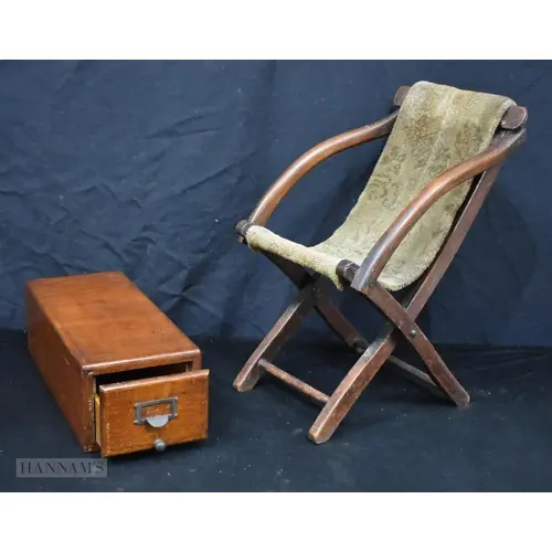 A late 19th Century wooden child's chair with a heavy carpet...