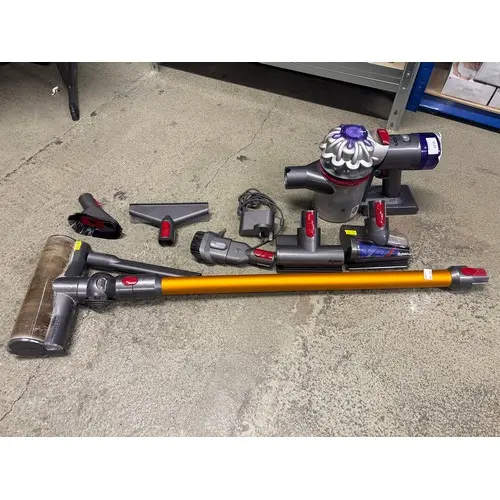 A Dyson V8 Absolute stick vacuum cleaner with charger, origi...