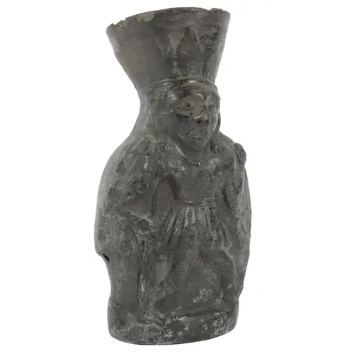 A South American Pre-Columbian style black earthenware figur...