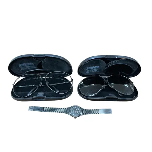 A Porsche design wrist watch, two pairs of Porsche sunglasse...