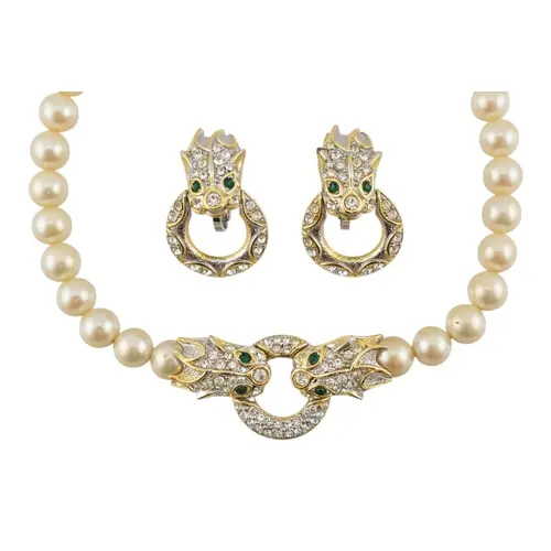 A faux pearl and gold tone dragon ring necklace and pair of ...