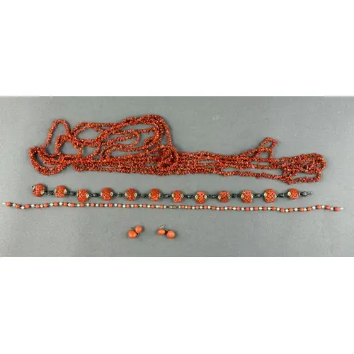 Jewellery: a silver gilt mounted coral panel necklace, each ...