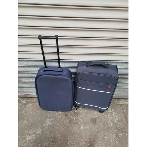 TWO SUITCASES INCLUDING SWISS DESIGN Note: all suitcases and...
