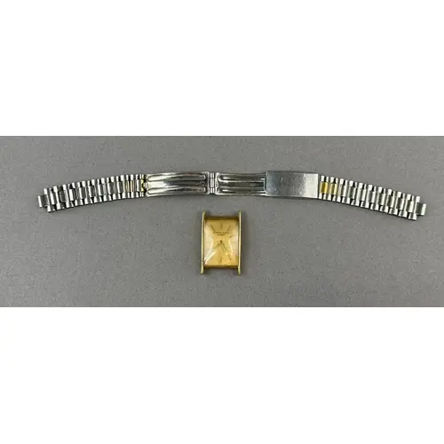 Watches: a gentleman's rectangular cased yellow metal watch ...