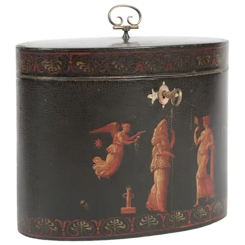 A George III Etruscan style black japanned oval tea caddy, a...
