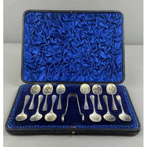 Silver: a set of twelve coffee spoons and tongs by Henry Atk...