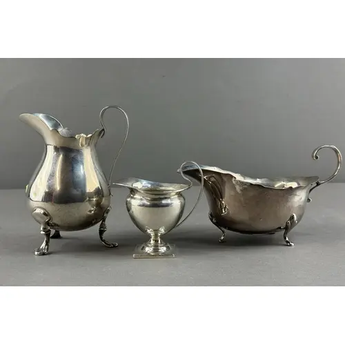 Silver: a sauce boat by William Suckling, Birmingham 1936; a...