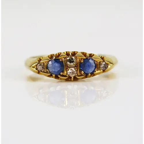 An antique sapphire and old cut diamond ring in an 18ct yell...