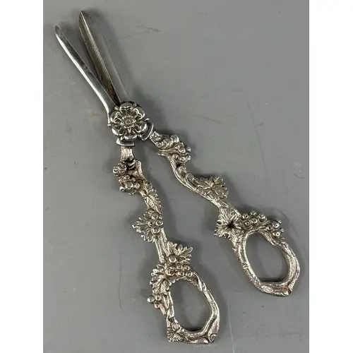 Silver Plate: a pair of white metal grape shears, the handle...